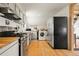 Updated kitchen with stainless steel appliances, washer and dryer, and butcher block countertops at 352 Apache Rd, Evergreen, CO 80439