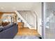 Living room open floor plan with hardwood floors and staircase at 352 Apache Rd, Evergreen, CO 80439