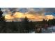 Enjoy gorgeous sunset views from the deck with views of nature and mountains at 352 Apache Rd, Evergreen, CO 80439
