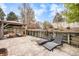 Spacious backyard with a concrete patio, retaining wall, and outdoor seating, perfect for entertaining at 11687 Decatur Dr, Westminster, CO 80234