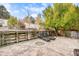 Well-maintained backyard with a concrete patio and retaining wall, ideal for outdoor relaxation and recreation at 11687 Decatur Dr, Westminster, CO 80234