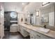 A luxurious bathroom with double vanity, framed mirrors, tub, and tiled shower at 11687 Decatur Dr, Westminster, CO 80234