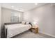 Neutral bedroom featuring a twin bed, a large window with blinds and a side table at 11687 Decatur Dr, Westminster, CO 80234