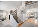 Bright foyer with staircase and an open floor plan to the dining and living areas at 11687 Decatur Dr, Westminster, CO 80234