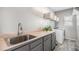 A clean laundry room with utility sink, modern appliances, and convenient storage solutions at 11687 Decatur Dr, Westminster, CO 80234