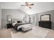 A serene main bedroom features plush carpet, a sitting bench, and neutral color palette at 11687 Decatur Dr, Westminster, CO 80234