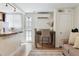 Cozy dining area with table and chairs, adjacent to the kitchen, hardwood flooring and nice natural light at 1532 N High St # 1, Denver, CO 80218