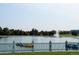 Scenic view of a lake with paddle boats and a fountain, surrounded by green trees, a relaxing escape at 1532 N High St # 1, Denver, CO 80218