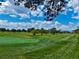 Lush golf course with manicured greens and distant city skyline, offering a scenic recreational experience at 1532 N High St # 1, Denver, CO 80218