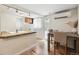 Well-lit kitchen featuring butcher block counters, hardwood floors, and a cozy dining space at 1532 N High St # 1, Denver, CO 80218