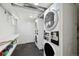 Bright laundry room with multiple machines and a folding station at 1532 N High St # 1, Denver, CO 80218
