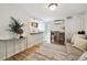Open-concept living space featuring hardwood floors and a combined kitchen and dining area at 1532 N High St # 1, Denver, CO 80218