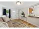 Inviting living area featuring hardwood floors and an open view into the kitchen at 1532 N High St # 1, Denver, CO 80218