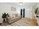 Cozy living room featuring a neutral color palette, hardwood floors, and modern decor at 1532 N High St # 1, Denver, CO 80218