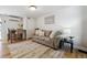 Inviting living room with a comfortable couch, stylish decor, and hardwood floors at 1532 N High St # 1, Denver, CO 80218