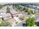 Aerial view showcasing a home with a driveway and well-kept lawn in a suburban neighborhood at 5552 Odessa St, Denver, CO 80249
