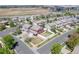 Aerial view of home highlighting backyard with privacy fence and patio with table and chairs at 5552 Odessa St, Denver, CO 80249