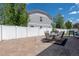 Inviting backyard patio with furniture and a white fence at 5552 Odessa St, Denver, CO 80249