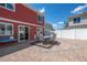 Spacious backyard with a brick patio, seating, and well-maintained fence at 5552 Odessa St, Denver, CO 80249