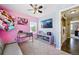 This bedroom has a large TV and is connected to the laundry room at 5552 Odessa St, Denver, CO 80249