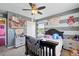 Bedroom with gray walls has 2 windows and a black wood bed frame at 5552 Odessa St, Denver, CO 80249