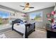 Bedroom with gray walls has 2 large windows that let in natural light at 5552 Odessa St, Denver, CO 80249