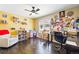 Bedroom boasts a ceiling fan, hardwood floors, and ample natural light from a nearby window at 5552 Odessa St, Denver, CO 80249
