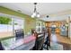 Bright dining room with views of the backyard and kitchen at 5552 Odessa St, Denver, CO 80249