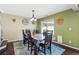 Formal dining room featuring wood floors, stylish decor, and ample seating at 5552 Odessa St, Denver, CO 80249