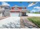 Inviting two-story home with a front porch and attached two-car garage at 5552 Odessa St, Denver, CO 80249