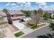 Two-story home with attached garage, driveway and landscaping at 5552 Odessa St, Denver, CO 80249