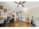 Open loft area with hardwood floors, guitars, and desk creates a versatile living space at 5552 Odessa St, Denver, CO 80249