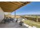 Backyard patio and seating area with an open view of the neighborhood at 14440 Hop Clover Trl, Parker, CO 80134