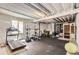 Basement gym space with carpet, gym equipment, and a window at 14440 Hop Clover Trl, Parker, CO 80134