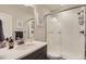 Modern bathroom featuring a glass-enclosed shower, sleek vanity, and contemporary finishes at 14440 Hop Clover Trl, Parker, CO 80134