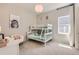 This room features bunk beds, fun artwork and cozy chair with natural light at 14440 Hop Clover Trl, Parker, CO 80134