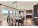 Dining area with long table and chairs, modern lighting fixture, and amazing views at 14440 Hop Clover Trl, Parker, CO 80134