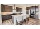 Modern kitchen with stainless steel appliances, white countertops, and ample storage space at 14440 Hop Clover Trl, Parker, CO 80134