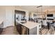Kitchen island with a great view of the dining area and living room at 14440 Hop Clover Trl, Parker, CO 80134