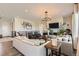 Inviting living room featuring a fireplace, stylish furnishings, and plenty of natural light at 14440 Hop Clover Trl, Parker, CO 80134