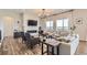 Bright living room with fireplace, a large sofa set, and great views from the windows at 14440 Hop Clover Trl, Parker, CO 80134