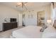 Serene primary bedroom boasts ensuite bath, large windows and a contemporary design at 14440 Hop Clover Trl, Parker, CO 80134