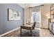 This office features a stylish desk and decor with natural light from a nearby window at 14440 Hop Clover Trl, Parker, CO 80134