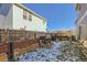 Landscaped backyard with a patio and grill at 10699 Durango Pl, Longmont, CO 80504