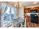 Charming dining area with table and chairs and sliding glass door to backyard at 10699 Durango Pl, Longmont, CO 80504