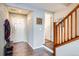 Bright and spacious entryway with hardwood floors and staircase at 10699 Durango Pl, Longmont, CO 80504