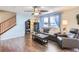 Living room with hardwood floors, fireplace, and comfortable seating at 10699 Durango Pl, Longmont, CO 80504