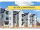 Modern townhome exteriors showcasing contemporary design, gray and white siding, and ample natural light from large windows at 5385 W 14Th Ave, Lakewood, CO 80214