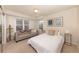 Inviting bedroom with a sofa, decorative pillows, and ample natural light from multiple windows at 218 Highland Ter, Breckenridge, CO 80424