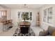 Well-lit dining room with modern chandelier, large bay window and spacious seating at 218 Highland Ter, Breckenridge, CO 80424